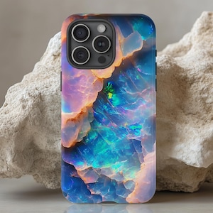 May include: A phone case with a colorful opal design. The case is black and has a raised camera bump. The opal design is iridescent and features shades of blue, green, pink, and orange.