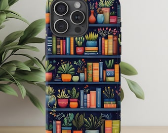 May include: A phone case with a colourful illustration of a bookshelf, packed with books and potted plants. The design has a dark blue backdrop with bright orange, green, and blue details, creating a cosy, literary theme.