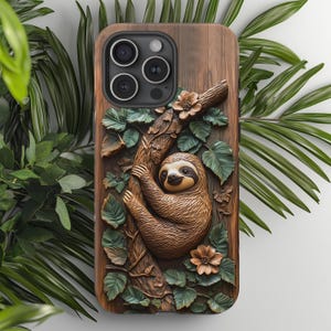May include: A wooden phone case with a carved sloth hanging from a branch. The case has a brown wood background with green leaves and flowers carved into the design.
