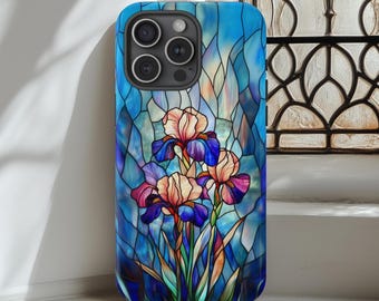 Puede incluir: Una funda para teléfono con un diseño de vitral con tres flores de iris moradas, rosas y blancas sobre un fondo azul.