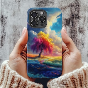May include: A colorful phone case with a vibrant landscape scene featuring a rainbow tree and a blue sky. The case has a cutout for the phone's camera.