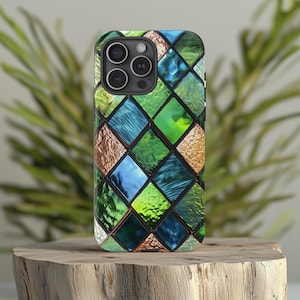 May include: A phone case with a stained glass design featuring green, blue, and gold diamond shapes.