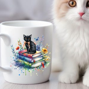 May include: White ceramic mug with a black cat sitting on a stack of colorful books. The cat is wearing a black bow tie and is surrounded by watercolor flowers.