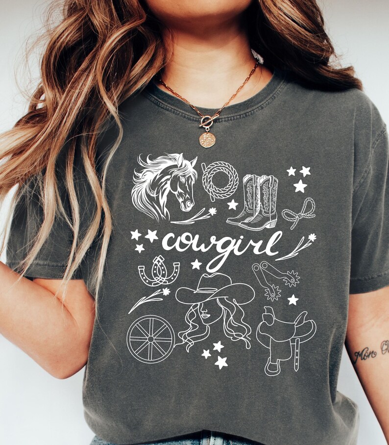Hand drawn cowgirl items on a cozy comfort colors t-shirt