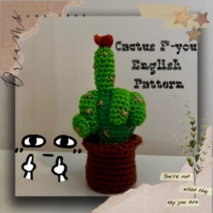May include: Crocheted cactus shaped like a middle finger in a brown pot. The cactus is green with brown accents and a red flower on top. The text "Cactus F-you English Pattern" is written in black on a white background.
