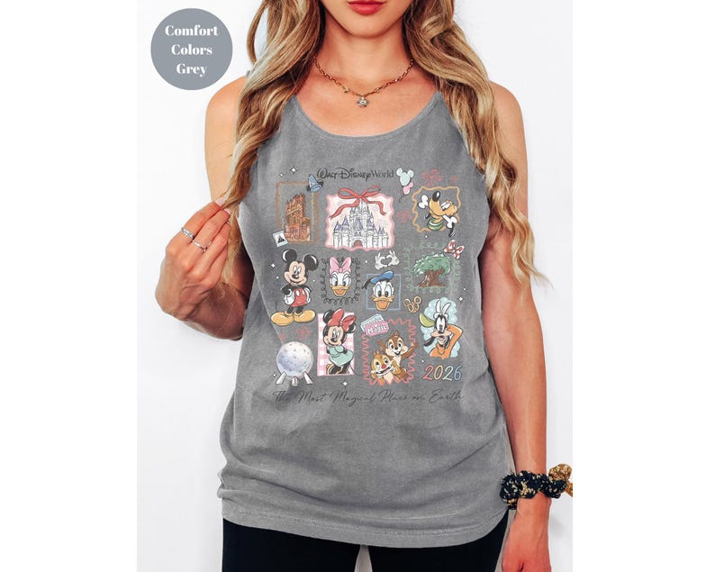 May include: Gray tank top featuring a collage of Disney characters and landmarks. The design includes Mickey Mouse, Minnie Mouse, Donald Duck, and Chip and Dale, with the text "Walt Disney World" and "2026". The phrase "The Most Magical Place on Earth" is also visible.