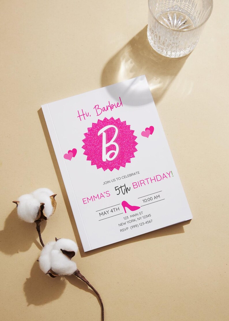 May include: A white invitation card with pink text and graphics, including the text "Hi, Barbiel", a large pink glittery "B", and the words "Emma's 5th Birthday!" The invitation also includes a high-heeled shoe graphic.