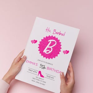 May include: A white invitation card with pink text and graphics, held by hands. The card reads "Hi, Barbiel" and "EMMA'S 5th BIRTHDAY!" with a pink high heel graphic. The background is a solid pink.