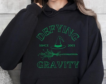 Custom Defying Gravity University Hoodie, Green Witch Core Sweatshirt, Wicked Hoodie, Wicca Lover Gift Idea, Viral Musical Movie Sweater