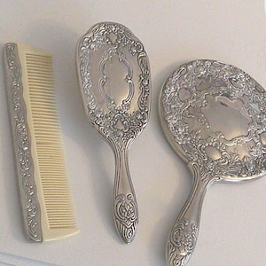 May include: A rustic wooden sign with the text "Welcome to our home" in white lettering. The sign features a distressed finish and a simple, inviting design, perfect for front door decor.