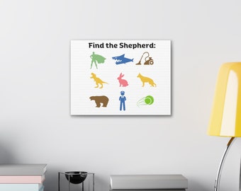 May include: A white canvas print with the text "Find the Shepherd:" at the top. The print features nine colorful silhouettes of various animals and objects, including a superhero, a shark, a vacuum cleaner, a dinosaur, a rabbit, a dog, a bear, a person in a uniform, and a tennis ball.