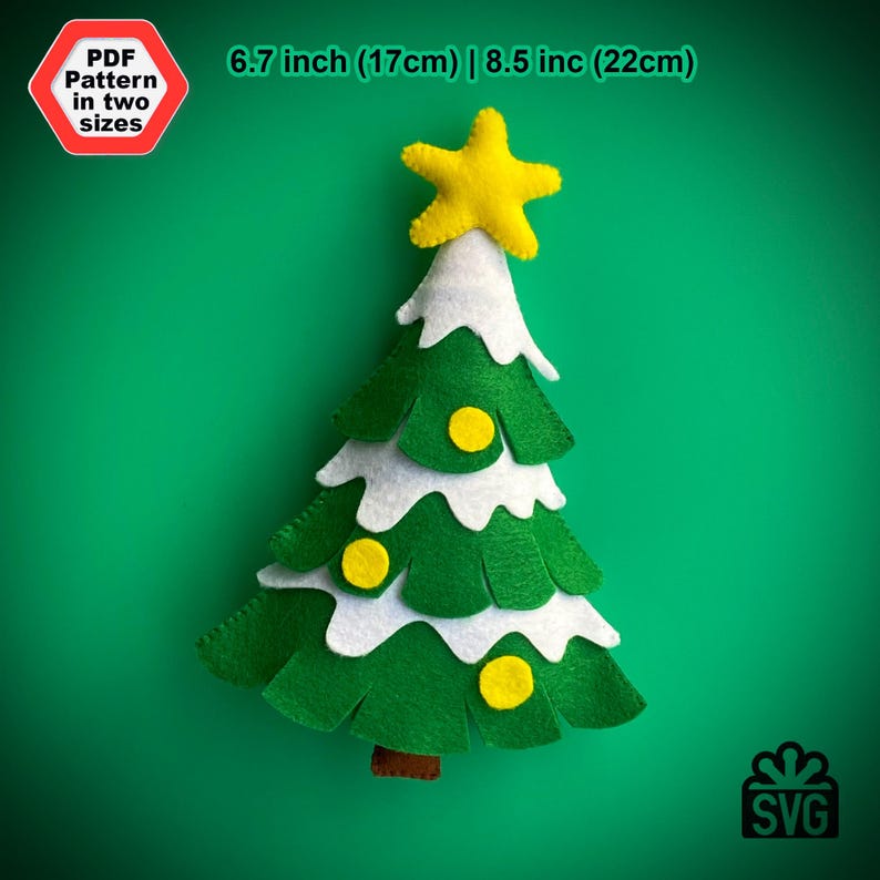 May include: A felt Christmas tree ornament with a white snowy base and yellow star on top. The tree is decorated with three yellow felt ornaments. The ornament is 6.7 inches (17 cm) or 8.5 inches (22 cm) in size.