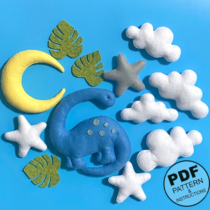 K&ouml;nnte beinhalten: Ein Set mit Filz-Applikationsvorlagen f&uuml;r einen Dinosaurier, Wolken, Sterne und Bl&auml;tter. Die Vorlagen sind im PDF-Format und beinhalten Anleitungen.