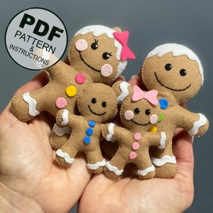 May include: A set of four felt gingerbread people, including a mom, dad, and two children. The gingerbread people are brown with white icing and colorful candy decorations. The PDF pattern and instructions are included.
