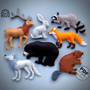 Può includere: Un set di giocattoli di animali in feltro, tra cui un cervo, un coniglio, un procione, una volpe, un orso, un castoro e un lupo. I giocattoli sono tutti di colori diversi e hanno caratteristiche realistiche. I giocattoli sono perfetti per i bambini per giocare e imparare a conoscere diversi animali.