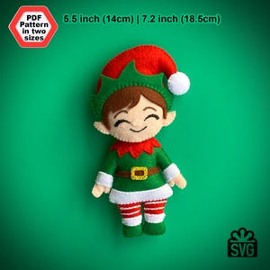 May include: A felt Christmas elf ornament pattern in two sizes: 5.5 inches (14 cm) and 7.2 inches (18.5 cm). The elf is wearing a green and red suit with a white hat and a gold belt.