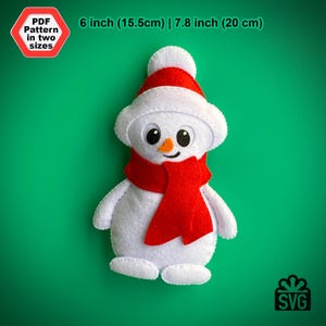 May include: A white felt snowman ornament with a red felt scarf and black button eyes. The snowman is 6 inches (15.5 cm) tall or 7.8 inches (20 cm) tall.  PDF and SVG patterns are available.