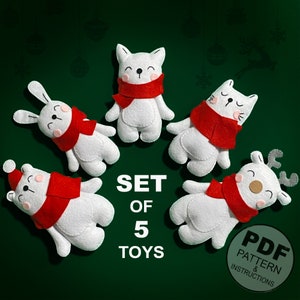 May include: Set of five felt Christmas toys, including a reindeer, a bunny, two cats, and a polar bear. Each toy is white with a red scarf and has a cute, cartoon-like face. The toys are arranged in a circle on a green background. The text "SET OF 5 TOYS" is printed below the toys.  PDF PATTERN & INSTRUCTIONS is printed on a red circle in the lower right corner.