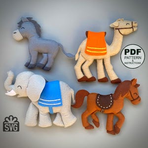 May include: Handmade felt animal toys including a gray donkey, a tan camel with an orange saddle, a gray elephant with a blue saddle, and a brown horse with a saddle. The image includes the text "PDF Pattern & Instructions" and an SVG logo.