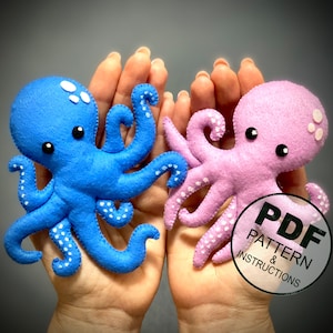 May include: Two felt octopus plushies, one blue and one pink, with white polka dots. The plushies are held in a person's hands. The image includes the text "PDF PATTERN & INSTRUCTIONS".