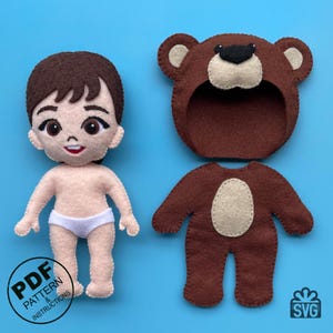 May include: A felt doll pattern for a child wearing a bear costume. The pattern includes a separate head, body, and bear costume pieces. The pattern is available in PDF and SVG formats. The text "PDF PATTERN & INSTRUCTIONS" is visible in the image.