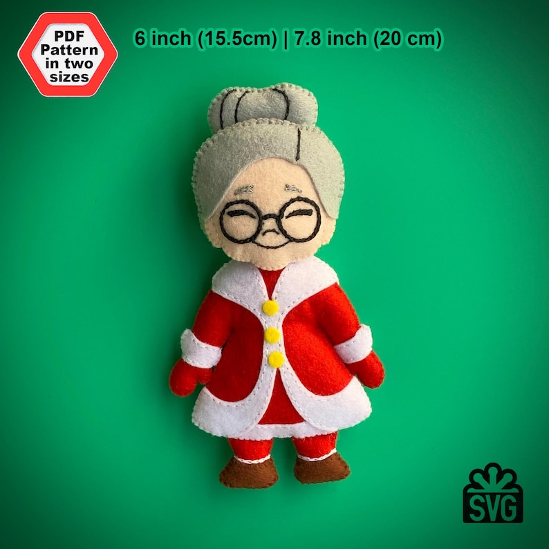May include: A felt Christmas ornament pattern of a grandmother wearing a red and white Santa suit with a white fur trim. The pattern is available in two sizes: 6 inches (15.5 cm) and 7.8 inches (20 cm).