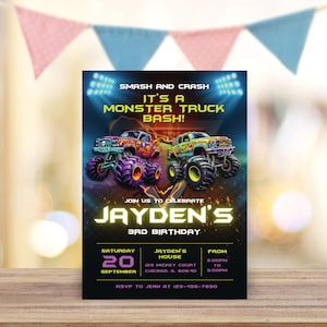 May include: A birthday invitation for a monster truck themed party. The invitation features two monster trucks, one purple and one green, with flames and skulls. The text on the invitation reads "Smash and Crash It's a Monster Truck Bash!" and "Jayden's 3rd Birthday".
