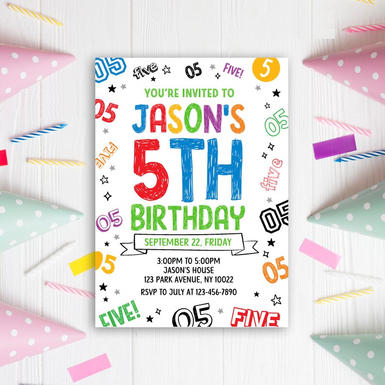 May include: A vibrant birthday invitation with the text "JASON'S 5TH BIRTHDAY" in bold, colourful letters. The invitation includes the date, time, and location. Party hats and candles surround the invitation on a white wooden surface.