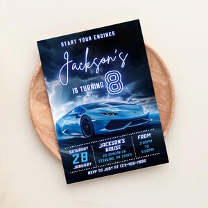 May include: A blue and black birthday invitation with a blue sports car and neon blue text that reads "Jackson's is turning 8". The invitation includes details for the party, including the date, time, and location. RSVP information is also included.