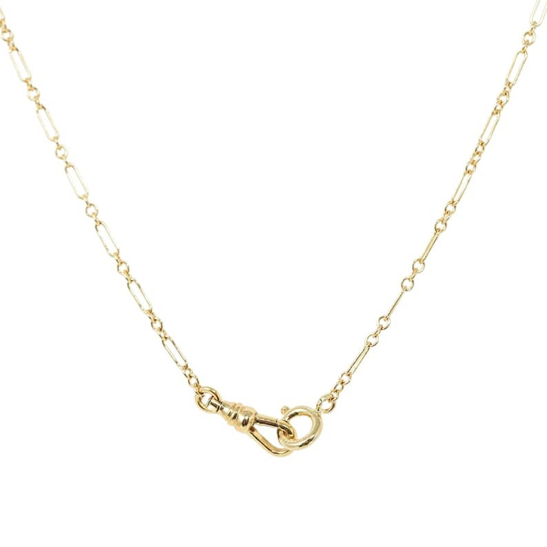 Quinney Collection's handcrafted gold filled Albert necklace, features a classic trombone link and a distinctive vintage style dog clip clasp. This piece is a modern homage to the timeless pocket watch chain, offering both style and practicality.