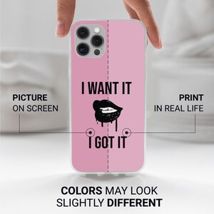 May include: A pink phone case with a black and white graphic of lips with the text "I WANT IT I GOT IT".