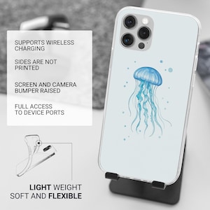 May include: A clear phone case with a blue jellyfish design. The case is compatible with wireless charging and has raised edges to protect the screen and camera.
