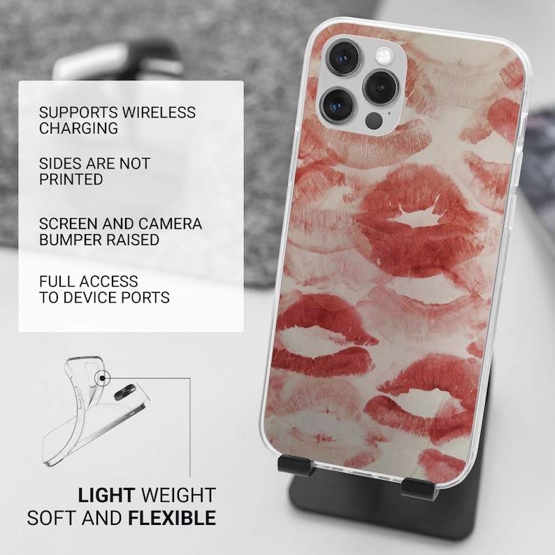 May include: A clear phone case with a red and white lipstick print design. The case is compatible with wireless charging and has raised edges to protect the screen and camera.