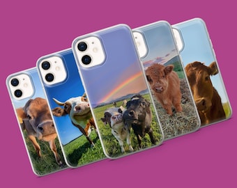 May include: Five clear phone cases with different cow images. The cases are all for the iPhone 13 Pro Max. The images include a brown and white cow, a black and white cow, a brown cow, a black and white cow, and a brown and white Highland cow.