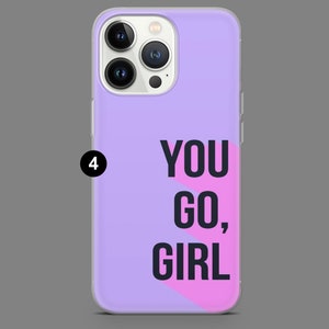 May include: A purple phone case with a pink and white geometric design. The text "YOU GO, GIRL" is printed in black on the case.
