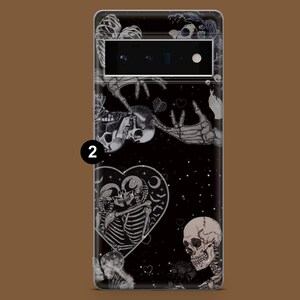 May include: Black phone case featuring a skeleton couple embracing within a heart, surrounded by other skeletons and stars. The case has a black background with a glittery effect.