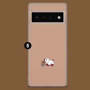 May include: A clear phone case with a light pink background and a cartoon image of a white dog wearing a ghost costume and holding a brown paper bag. The dog has red ears and a red nose.