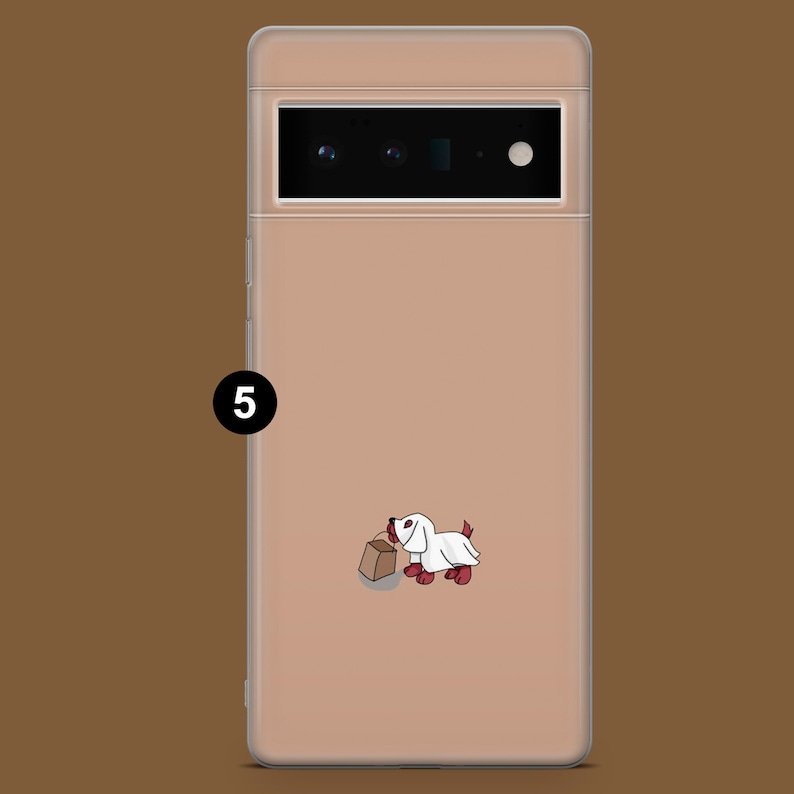 May include: A clear phone case with a light pink background and a cartoon image of a white dog wearing a ghost costume and holding a brown paper bag. The dog has red ears and a red nose.