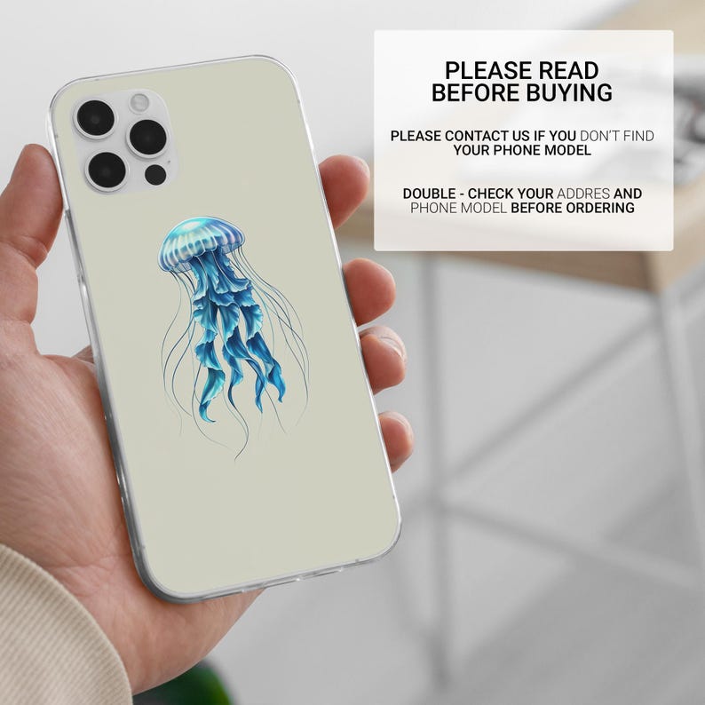 May include: A clear phone case with a blue jellyfish illustration. The case is designed for a phone with a triple camera lens.