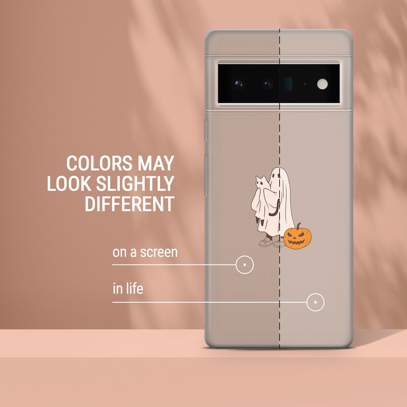 May include: A clear phone case with a white ghost holding a cat and a jack-o'-lantern. The case is designed for a phone with a rectangular camera housing.