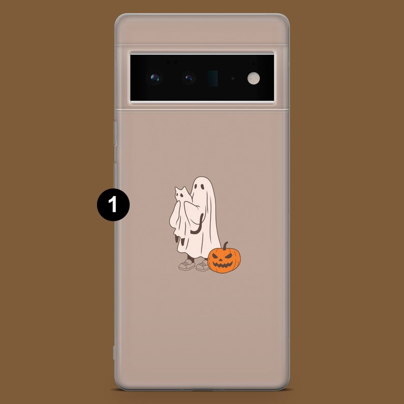 May include: A clear phone case with a white ghost holding a smaller white ghost and a jack-o'-lantern. The case is designed for a phone with a triple camera lens.