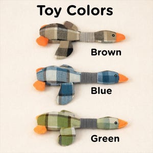 May include: Three fabric goose toys in brown, blue, and green plaid patterns, with orange beaks and feet. Each toy has a grey ribbed neck. The text "Toy Colors" is at the top, with the colour names below each toy.