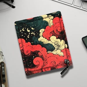 May include: A rectangular case with a vibrant, swirling cloud design in red, yellow, and teal against a black background. The case has a black zipper and a red stitched border. The case is likely for a phone or small electronic device.