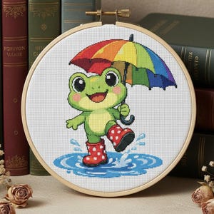 Adorable frog with rainbow umbrella cross stitch spring or rainy weather theme handmade colorful wall art perfect gift for children