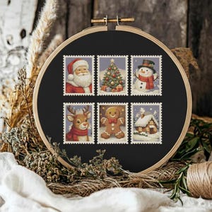 May include: A cross-stitch embroidery hoop featuring six Christmas-themed postage stamp designs. The stamps depict Santa Claus, a decorated Christmas tree, a snowman, a reindeer, a gingerbread man, and a snow-covered cottage. The background is black.