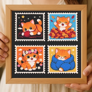 May include: A framed artwork featuring four postage stamp designs with orange tabby cats. Each cat is in a different pose, including playing with yarn, in a pile of leaves, wearing a flower crown, and wrapped in a blue scarf.