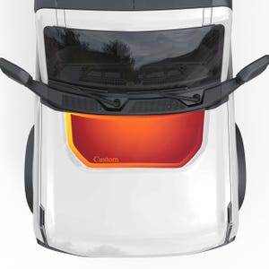 May include: A white truck with a custom red and orange hood decal. The decal has the word "Custom" printed on it.