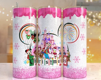 May include: Pink glitter tumbler with a white background and a Christmas scene featuring Mickey Mouse and friends in front of Cinderella's Castle. The text "Christmas" is written in green letters on the bottom of the tumbler.