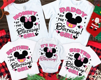 May include: Set of five white t-shirts with pink and black Mickey Mouse designs. The shirts say "Mommy of the Birthday Girl", "Daddy of the Birthday Girl", "Brother of the Birthday Girl", "Sister of the Birthday Girl", and "It's My Birthday!"