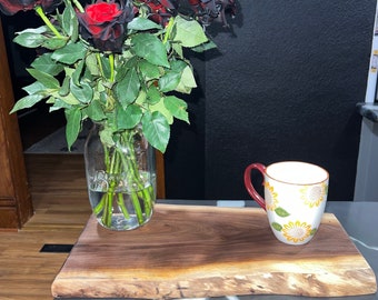 18in X 10in black walnut live edge cutting board, charcuterie board, counter piece or table piece.